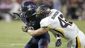 Toledo's Mark Singer (43) tackle causes