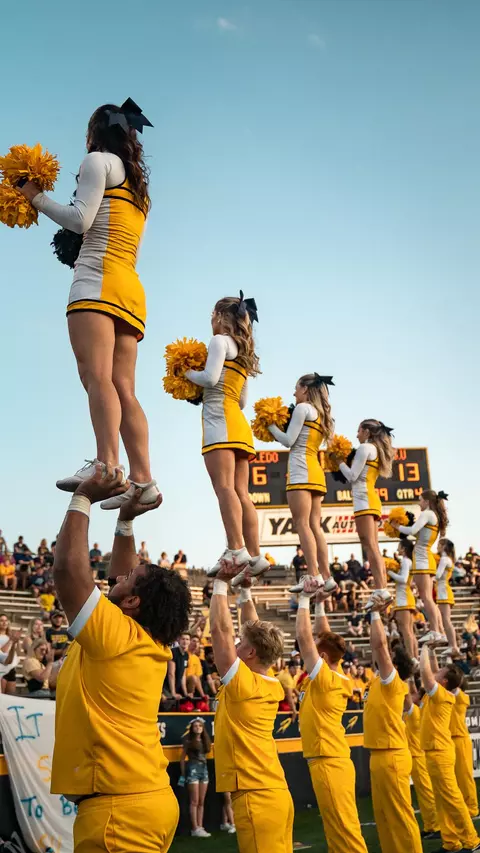 Cheerleaders Stunting at the Glass Bowl