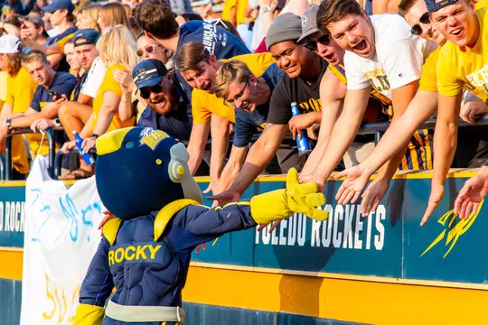 Rocky giving High Fives to fans at the Glass Bowl