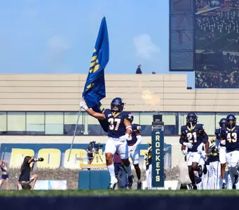 Damon Ollison Carrying Flag (vs Western Michigan Sep.23)