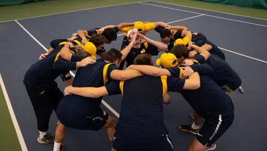 Men's Tennis huddle at Shadow Valley