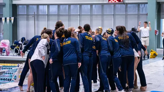 swim team huddle on senior day