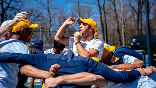 Adam Kovac & MT huddle