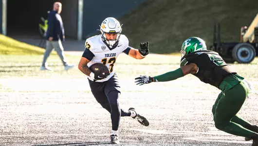 Cooper Rusk catches a pass against Eastern Michigan