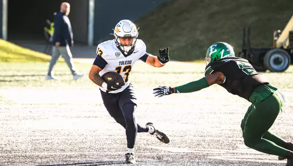 Cooper Rusk catches a pass against Eastern Michigan