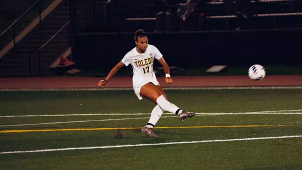 Abby-Lee Sanogo kicks a soccer ball