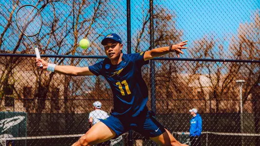 Poonthong Komolpisut hitting the ball during action