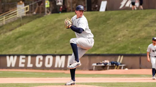 Michael Fliss throws a pitch in a gray uniform