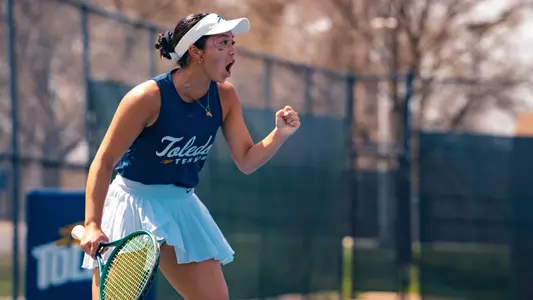 Isabella Barretto celebrating a point on the UT Varsity Tennis Courts