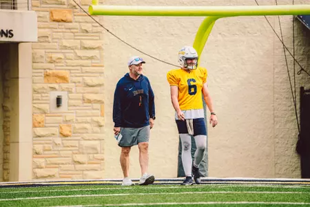 Head Coach Mike Jacobs with John Alan Richter at practice