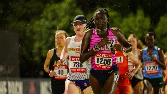 Dorcas Kiptantui running at the 2026 Raleigh Relays in the rain