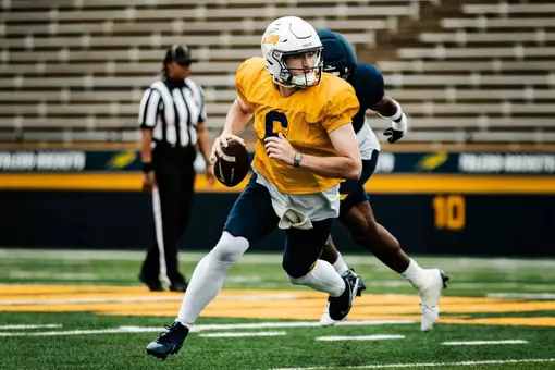 QB John Alan Richter evades a pass rusher at 2026 Spring Game
