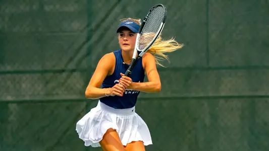 Annika Munson hits the ball at the UT Varsity Tennis Courts