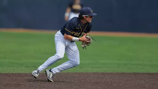 Charlie Scholvin gathers to throw the baseball while playing shortstop