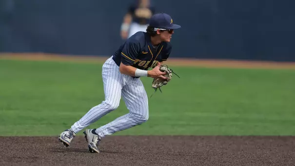 Charlie Scholvin gathers to throw the baseball while playing shortstop