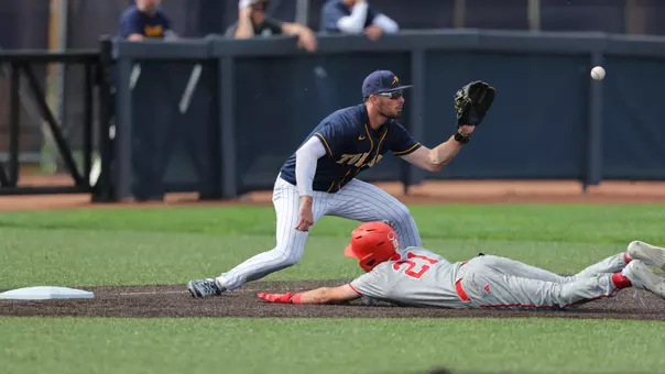 Troy Sudbrook catching a baseball against Miami