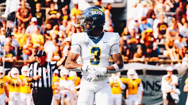 Andre Fuller standing before a play