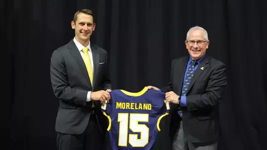 Tom Moreland with President Holloway holding jersey
