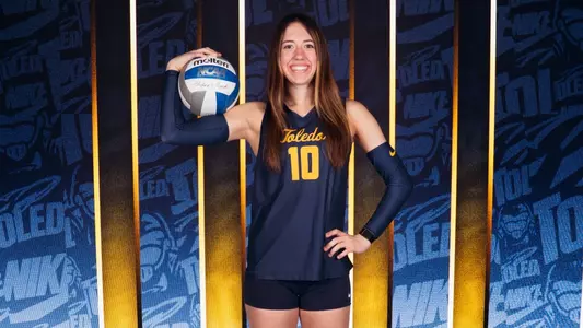 Lilly Merk poses with a volleyball
