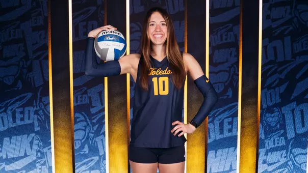 Lilly Merk poses with a volleyball