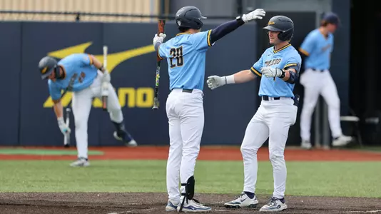 Cole Cahill and Cade Baker celebrate a home run