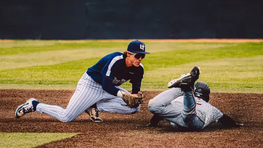 Charlie Scholvin makes a tag on a runner stealing