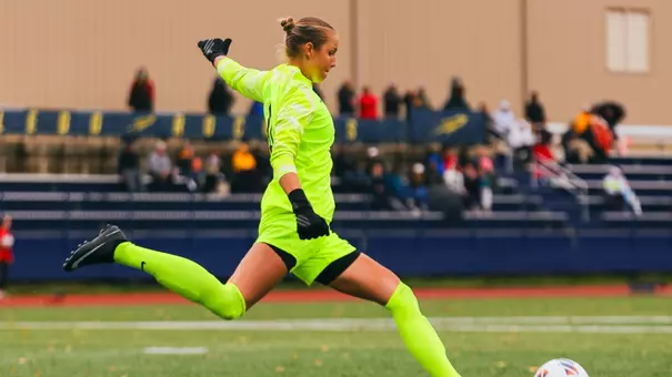 Agnes Stenlund goes to kick a soccer ball on a goal kick