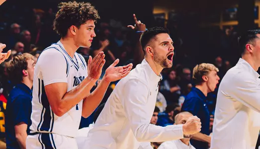 Brett Rau cheering on the bench
