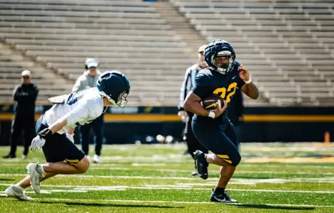CJ Miller rushing the football