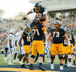 Matt Hofer lifts running back CJ Miller after a touchdown