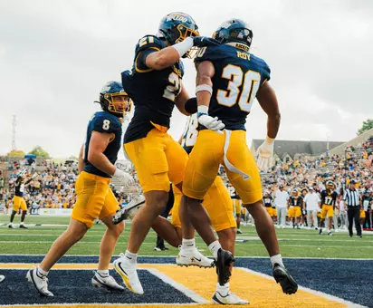 Hayden Roy celebrates after scoring a touchdown