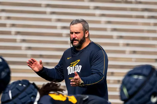 Toledo offensive line coach Brian Folkerts coaching during practice