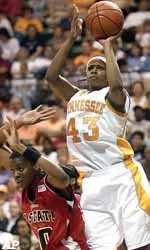 Shyra Ely puts up a shot over the back of North Carolina State's Kaayla Chone earlier in the year.
