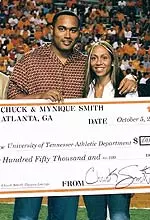 Former Vol Chuck Smith and his wife, Mynique, presented UT a check for $150,000 prior to the Vols' game against Arkansas.
