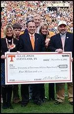 Allan Jones and his wife Janie, present the check to the University of Tennessee.