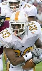 Tennessee's Derrick Tinsley (20) races for first down yardage during the first quarter.