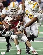 Maryland running back Steve Suter is stopped by Tennessee defenders Omari Hand (91) and Rashad Moore (58) in the second quarter.
