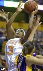 Tennessee's Shyra Ely (43) shoots over LSU's Aiysha Smith (31).