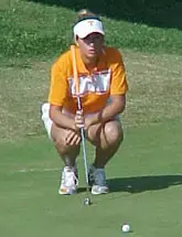 Perry sets up for a putt.