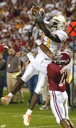 James Banks (11) pulls in a 2-point conversion over Alabama's Ramzee Robinson (17) in the fifth overtime.