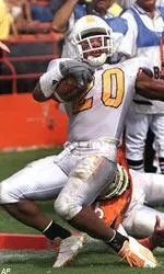 Wide receiver Derrick Tinsley scores a touchdown in the second quarter against Miami.