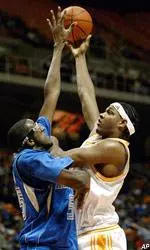Brandon Crump shoots over North Carolina-Asheville's C.J. Walker during the first half.
