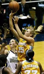 Brittany Jackson shoots over George Washington's Cathy Joens and Ugo Oha during the first half.