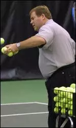 Mike Patrick hits some practice balls to his players