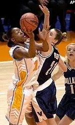 Forward Gwen Jackson shoots over Villanova's Jana Rediger and Trish Juhline in the first half.