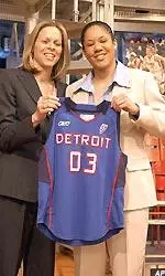 Kara Lawson holds up her new jersey with WNBA President Val Ackerman after being selected fifth overall by the Detroit Shock in the 2003 WNBA draft.