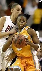 Tasha Butts works against Connecticut guard Diana Taurasi in the second half.