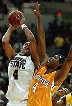 Lawrence Roberts shoots over Tennessee's Brandon Crump. (AP Photo)