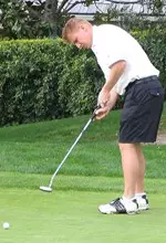 Ross McGowan putts for birdie on the 3rd hole.
