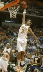Tennessee's Candace Parker (3) dunks the ball against West Virginia's Lateefah Joye (31) during the first half of their college basketball game Wednesday, Dec. 20, 2006 in Knoxville, Tenn.(AP Photo/Wade Payne)